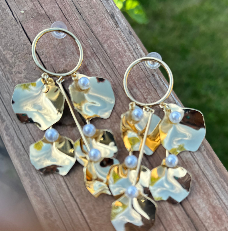 Golden Petal Cascade Earrings featuring dangling gold petal-shaped charms with faux pearls, statement jewelry for women