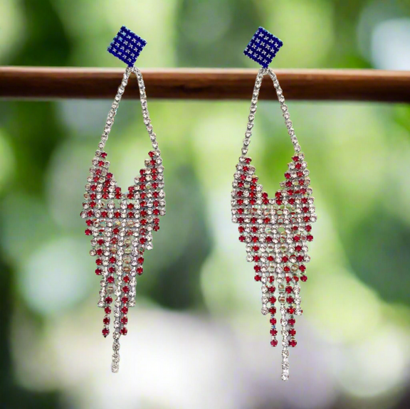 Long red, white, and blue rhinestone fringe earrings with a blue star-studded stud top and cascading sparkly fringe design.