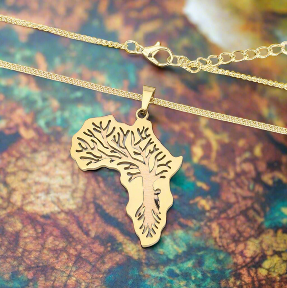 Gold-plated Africa map pendant necklace with intricate Tree of Life design on a delicate gold chain, displayed on a white background.