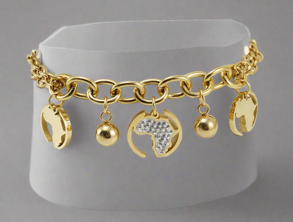 “Gold Africa charm bracelet with double link chain, gold map cutouts, rhinestone accents, and polished gold spheres, displayed on a white background.”