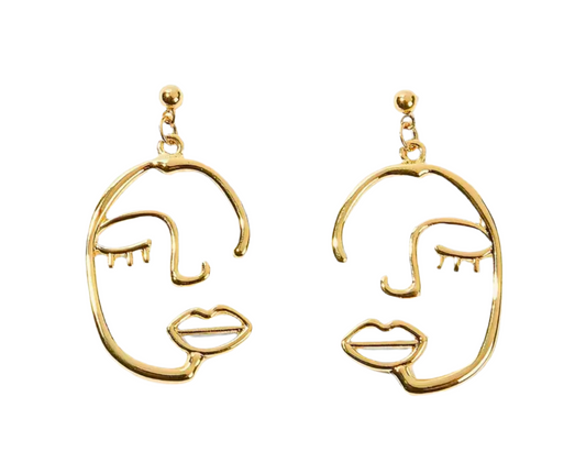 The La Muse earrings, by Desiree W.A.R Store, feature a sleek line design on a pristine white background. Capturing the essence of modern abstract art, they epitomize artistic jewelry in an elegant form.