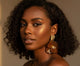 Ayira Amber Petal Earrings — elegant brown floral statement earrings with layered resin petals and textured gold stud tops, reflecting warm golden light for a regal, sophisticated look.