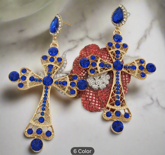 Royal Cross Statement Earrings featuring gold-tone filigree crosses adorned with sapphire-blue rhinestones and sparkling crystal accents, bold statement jewelry for women.