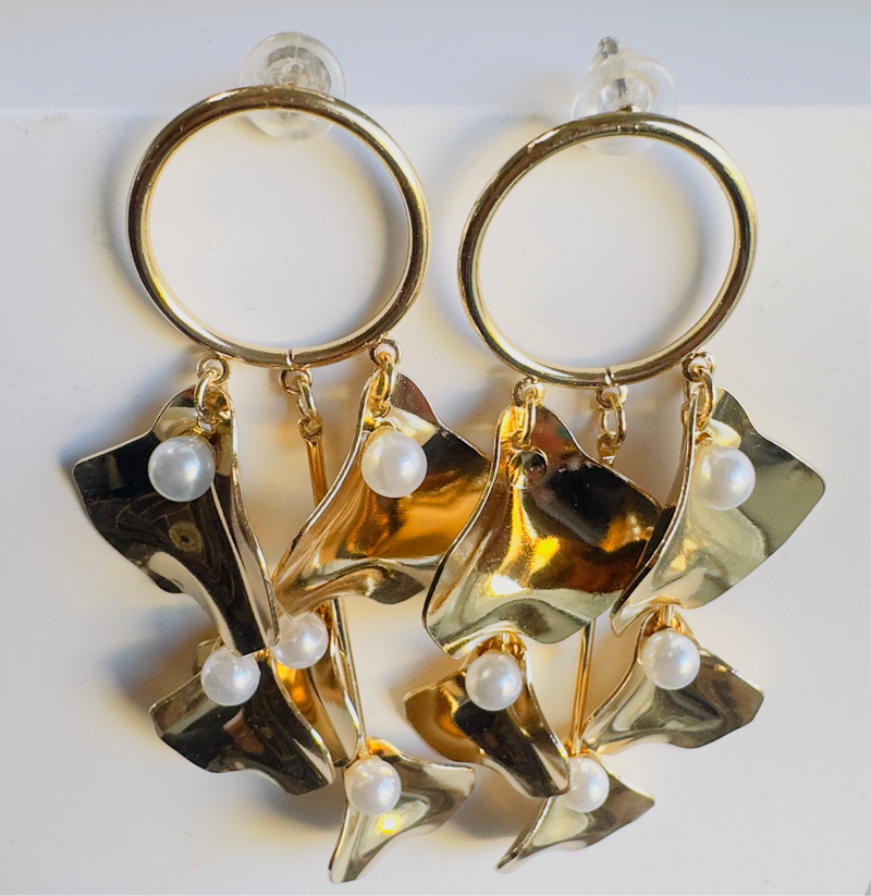 Golden Petal Cascade Earrings featuring dangling gold petal-shaped charms with faux pearls, statement jewelry for women