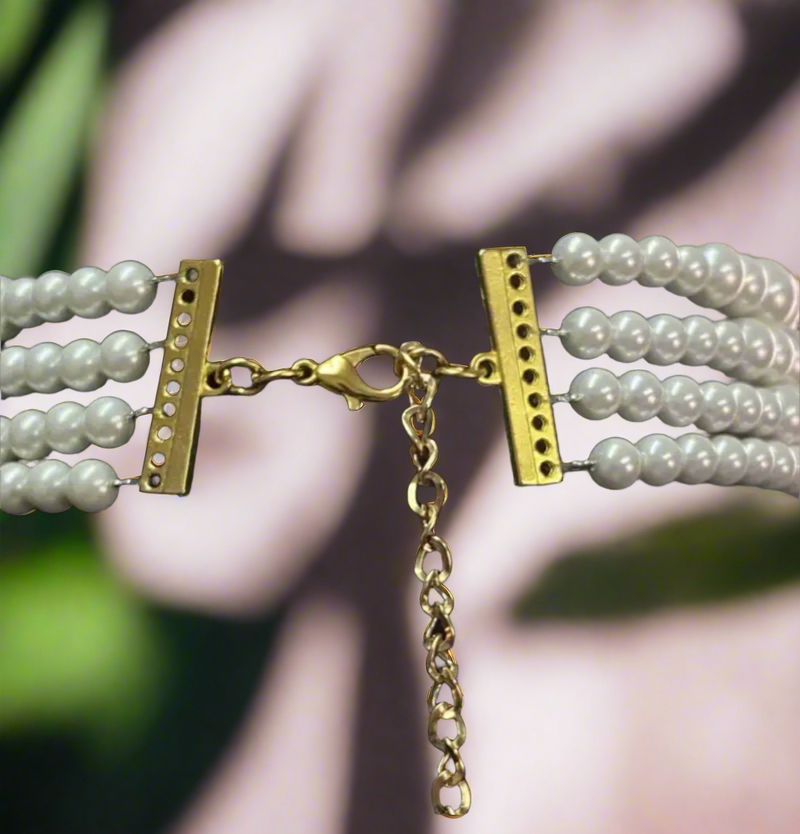 Multi-strand pearl choker necklace with ornate gold filigree cross pendant featuring faux pearls and teardrop pearl drops, elegant and vintage style.
