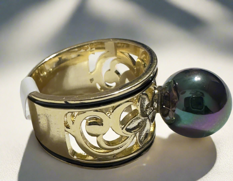Gold-tone floral filigree statement ring featuring a black iridescent pearl with green and purple hues, perfect for elegant and luxurious styling