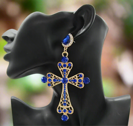 Royal Cross Statement Earrings featuring gold-tone filigree crosses adorned with sapphire-blue rhinestones and sparkling crystal accents, bold statement jewelry for women.