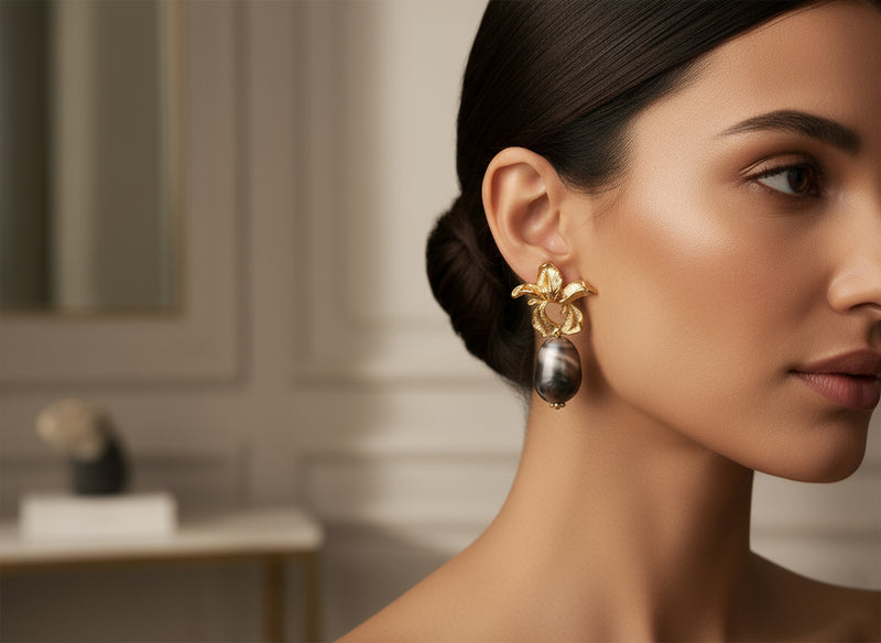 “Afia Orchid” statement earrings in radiant gold and floral design — inspired by the strength and beauty of the orchid flower. A perfect accessory that symbolizes grace, resilience, and feminine power.