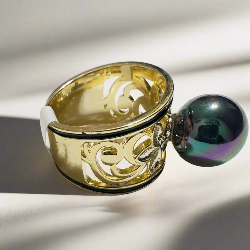 Gold-tone floral filigree statement ring featuring a black iridescent pearl with green and purple hues, perfect for elegant and luxurious styling