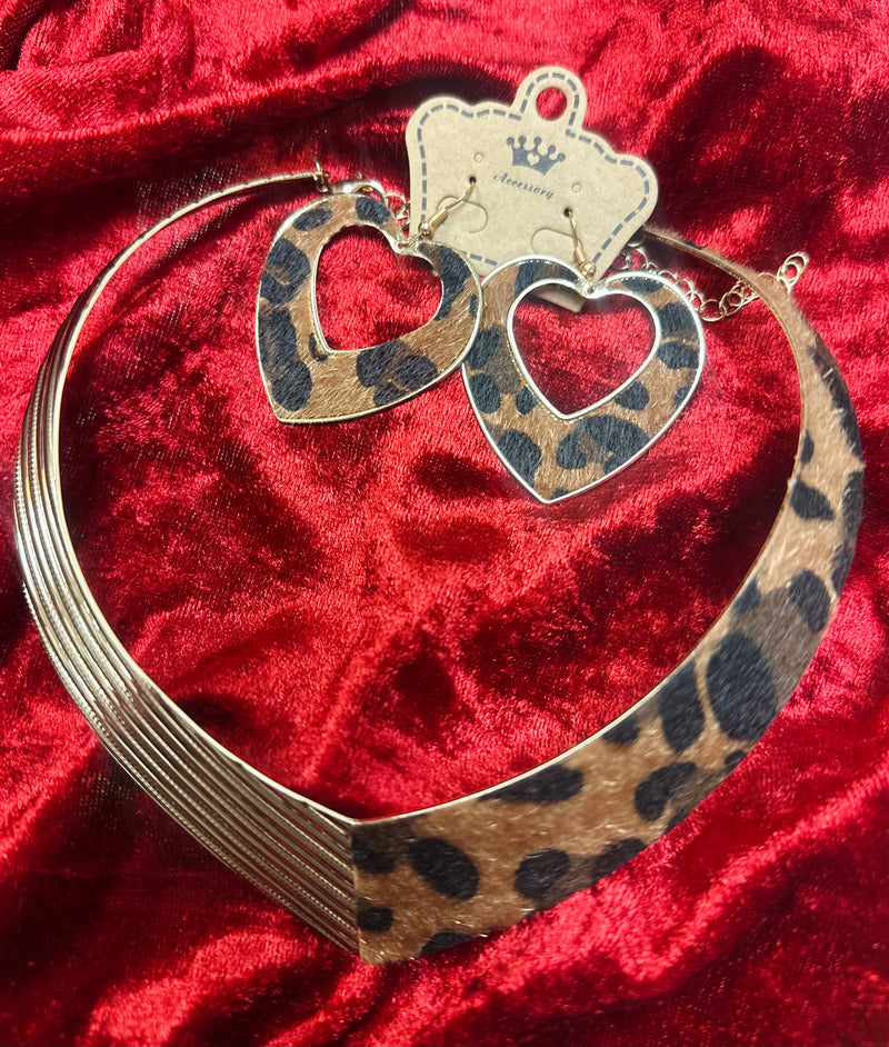 Leopard print heart jewelry set featuring a bold choker necklace with metallic accents and matching heart-shaped dangle earrings, fashion statement jewelry for women.”
