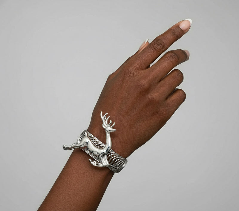 Silver reindeer-shaped jewelry box on a white background