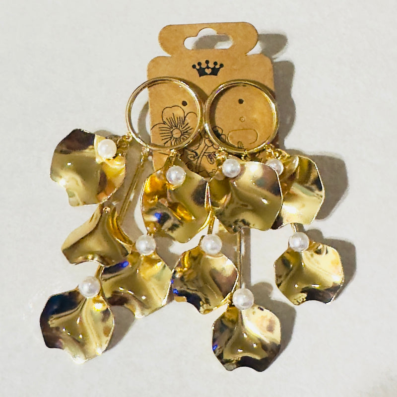 Golden Petal Cascade Earrings featuring dangling gold petal-shaped charms with faux pearls, statement jewelry for women
