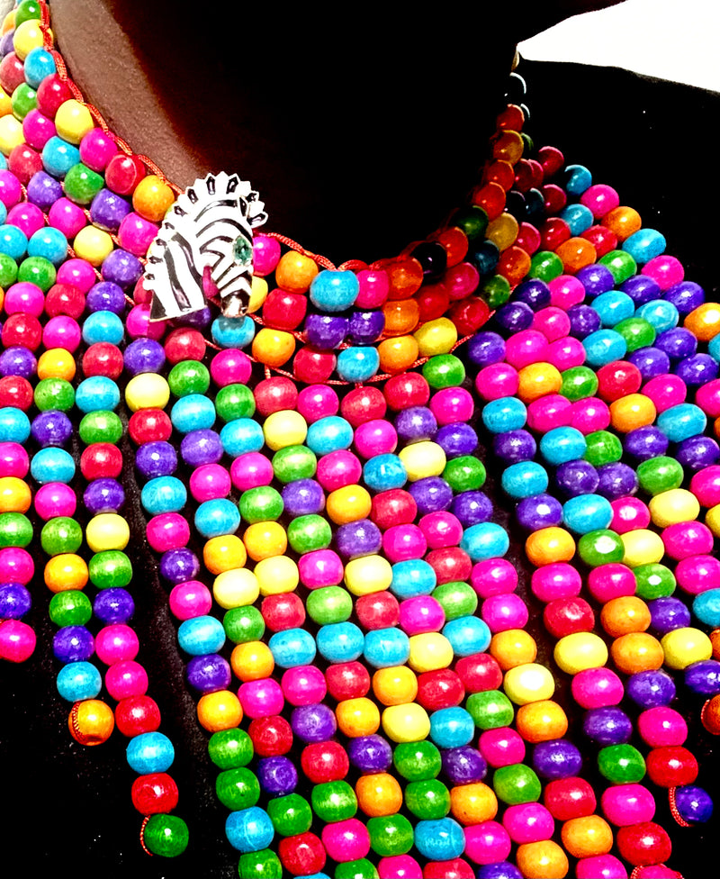 Elegant enamel zebra brooch with black and white stripes, gold-plated details, and a striking emerald-green gemstone eye, perfect for adding a touch of luxury and boldness to any outfit.