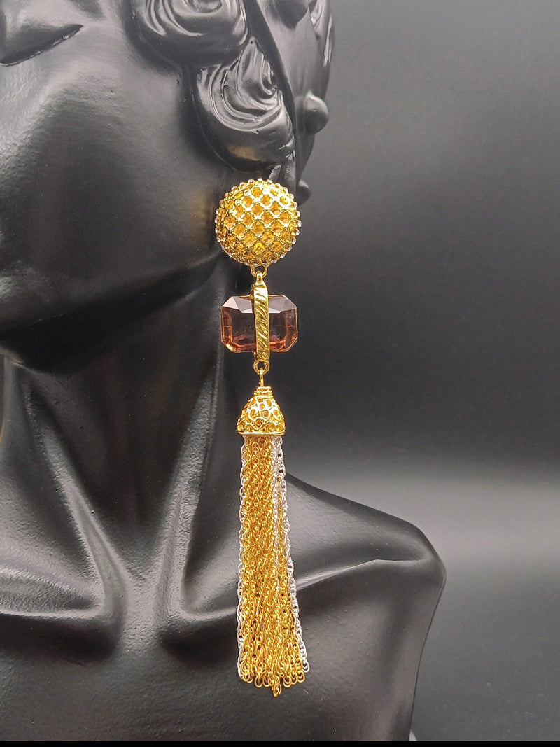 Adira Royal Tassel Earrings featuring a textured gold stud, brown gemstone, and elegant cascading gold and silver tassels – a bold and luxurious statement piece.