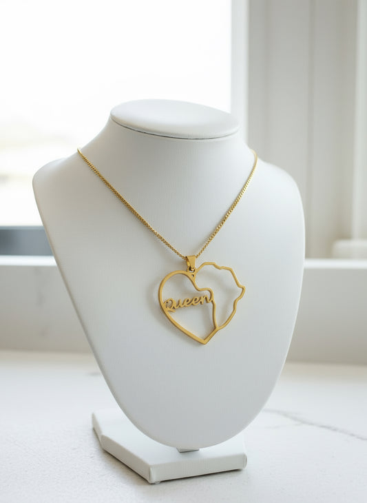 Gold necklace with a heart-shaped pendant on a white mannequin bust.