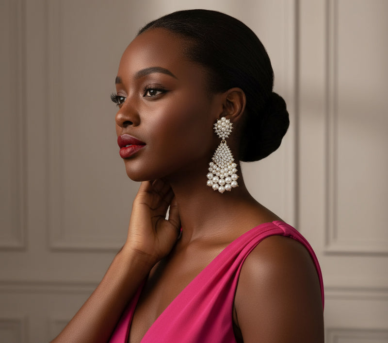 Modestine Cascade Earrings — elegant gold statement earrings featuring cascading pearls and sparkling crystals, perfect for weddings and special occasions